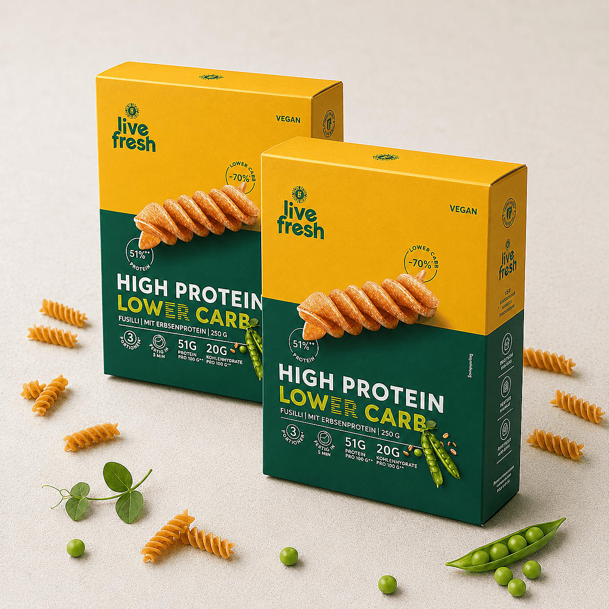 LiveFresh High Protein Lower Carb Fusilli Doppelpack mit zwei Nudelpackungen, Erbsen und einzelnen Fusilli auf hellem Hintergrund.